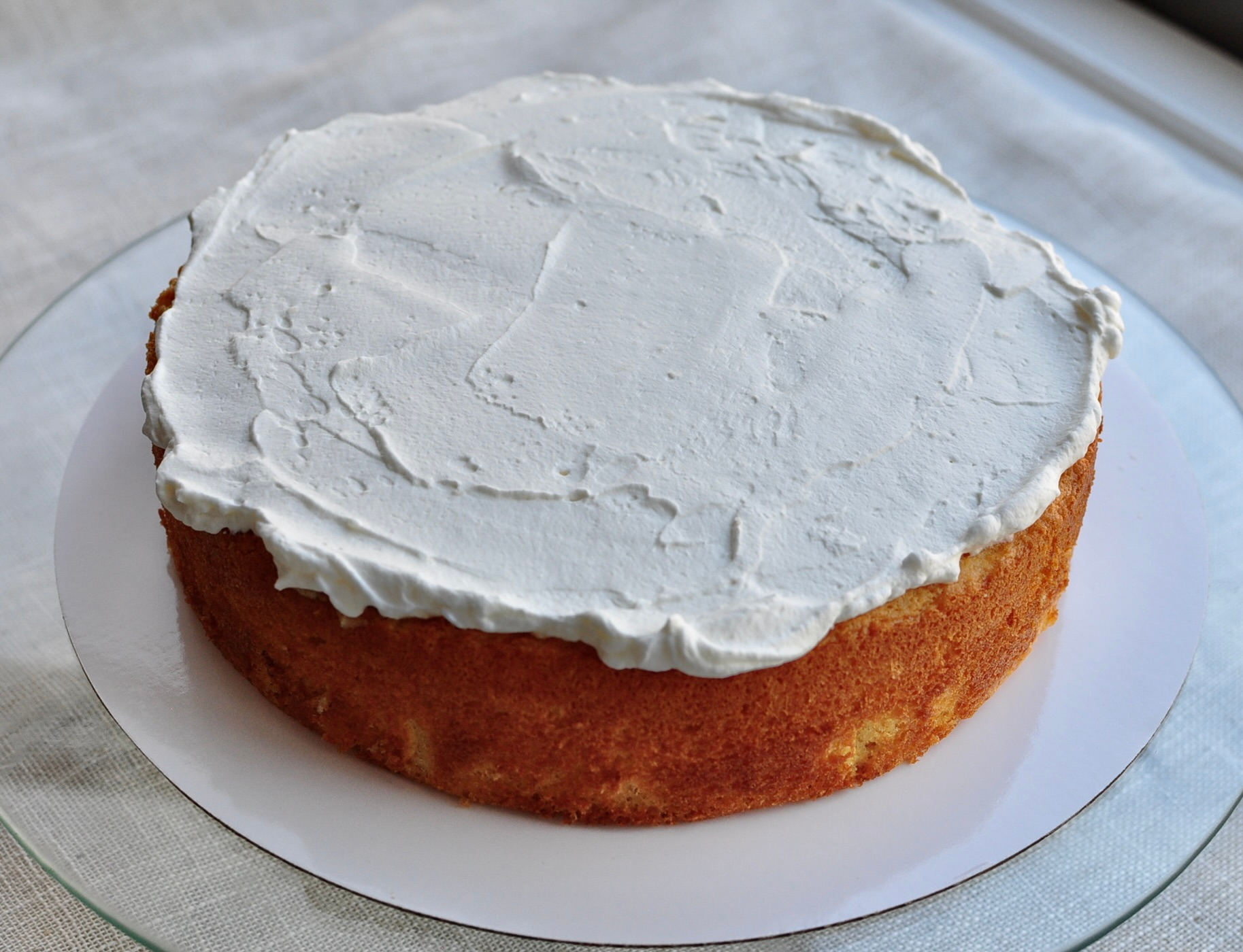 Whipped cream over first cake layer