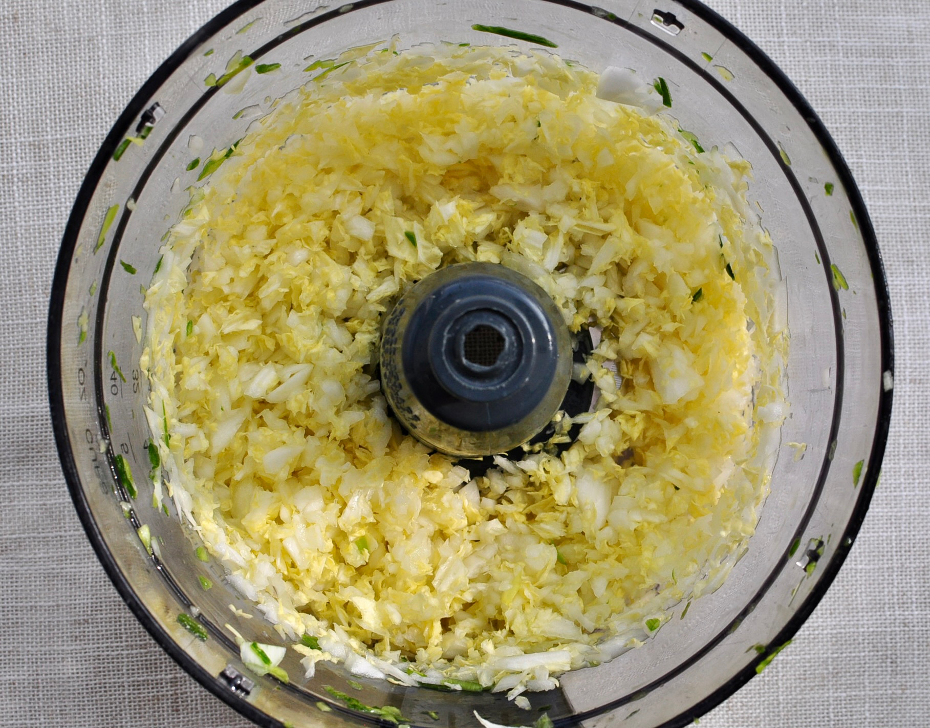 Pulse napa cabbage in a food processor until finely chopped