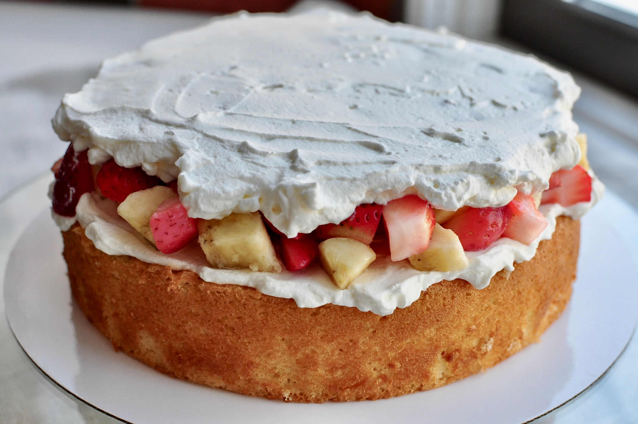 Whipped cream and fruit layer of cake