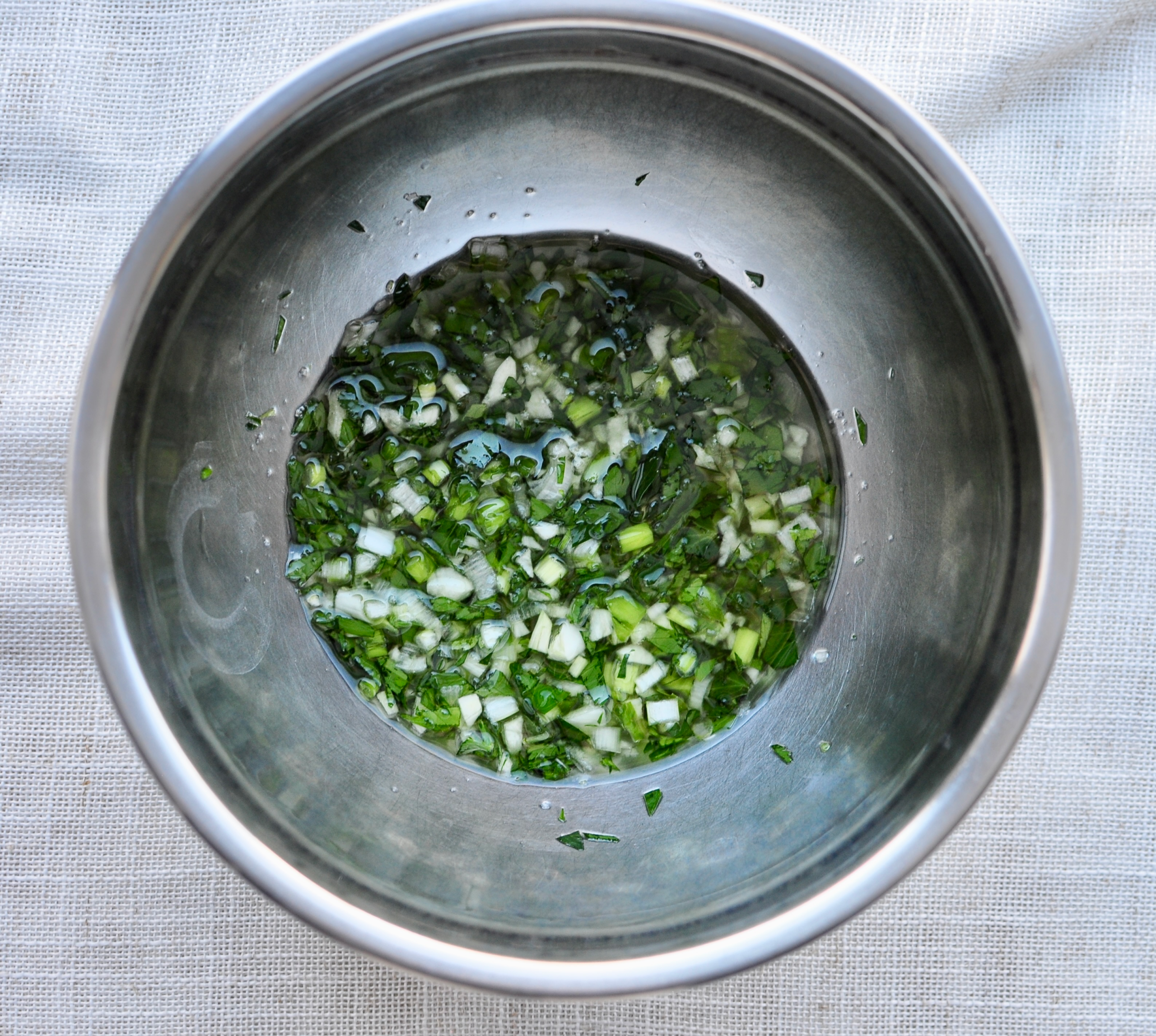 Parsley, scallions, garlic, lemon and olive oil for lobster tails