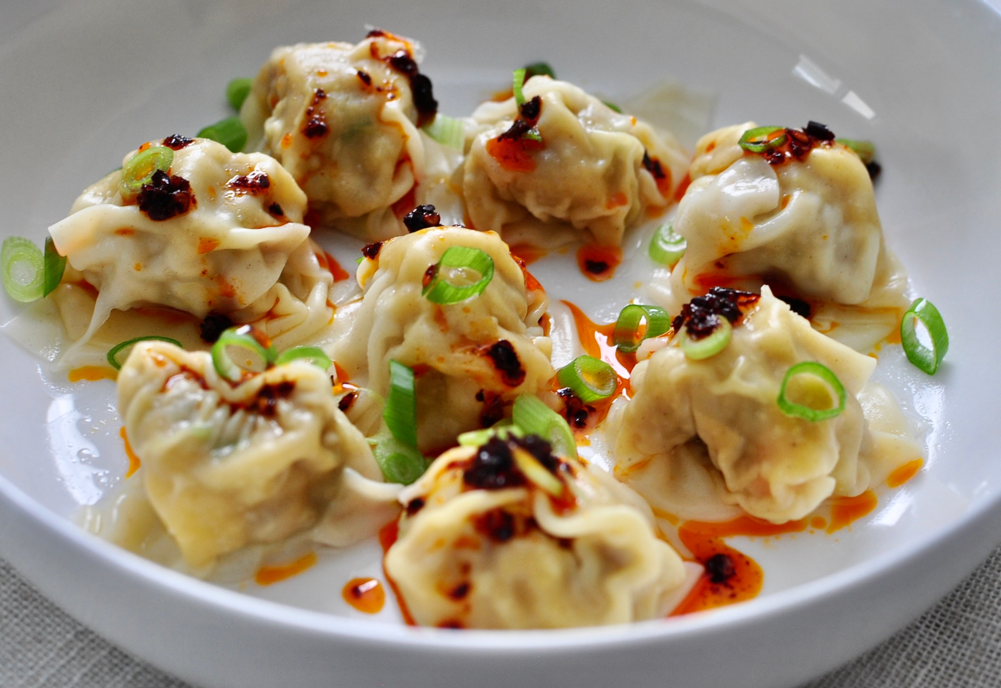 Pork and Shrimp Wonton Recipe Served with Scallions and Chili Crisp Oil