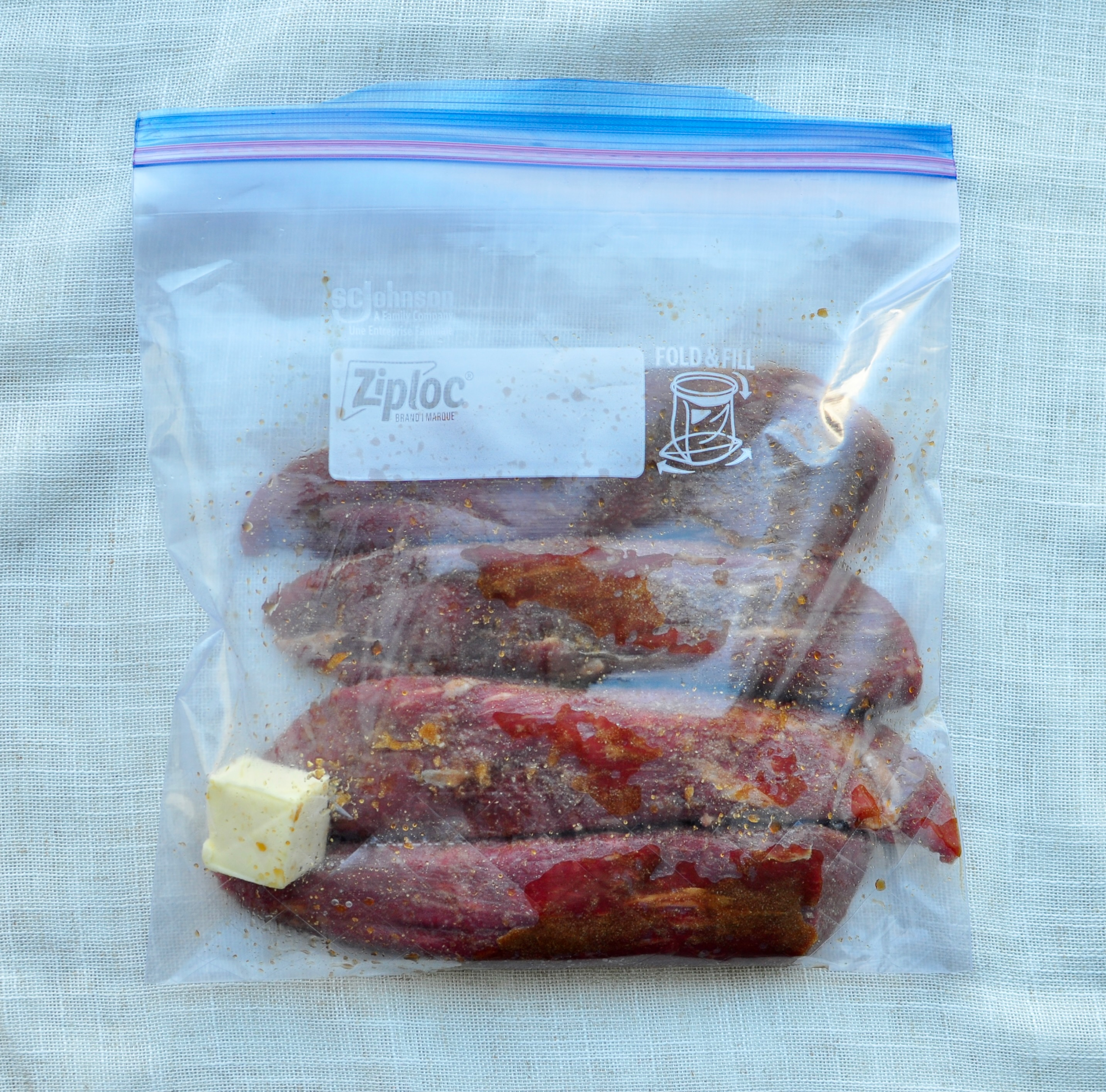 Seasoned petite filets in ziplock bag for sous vide