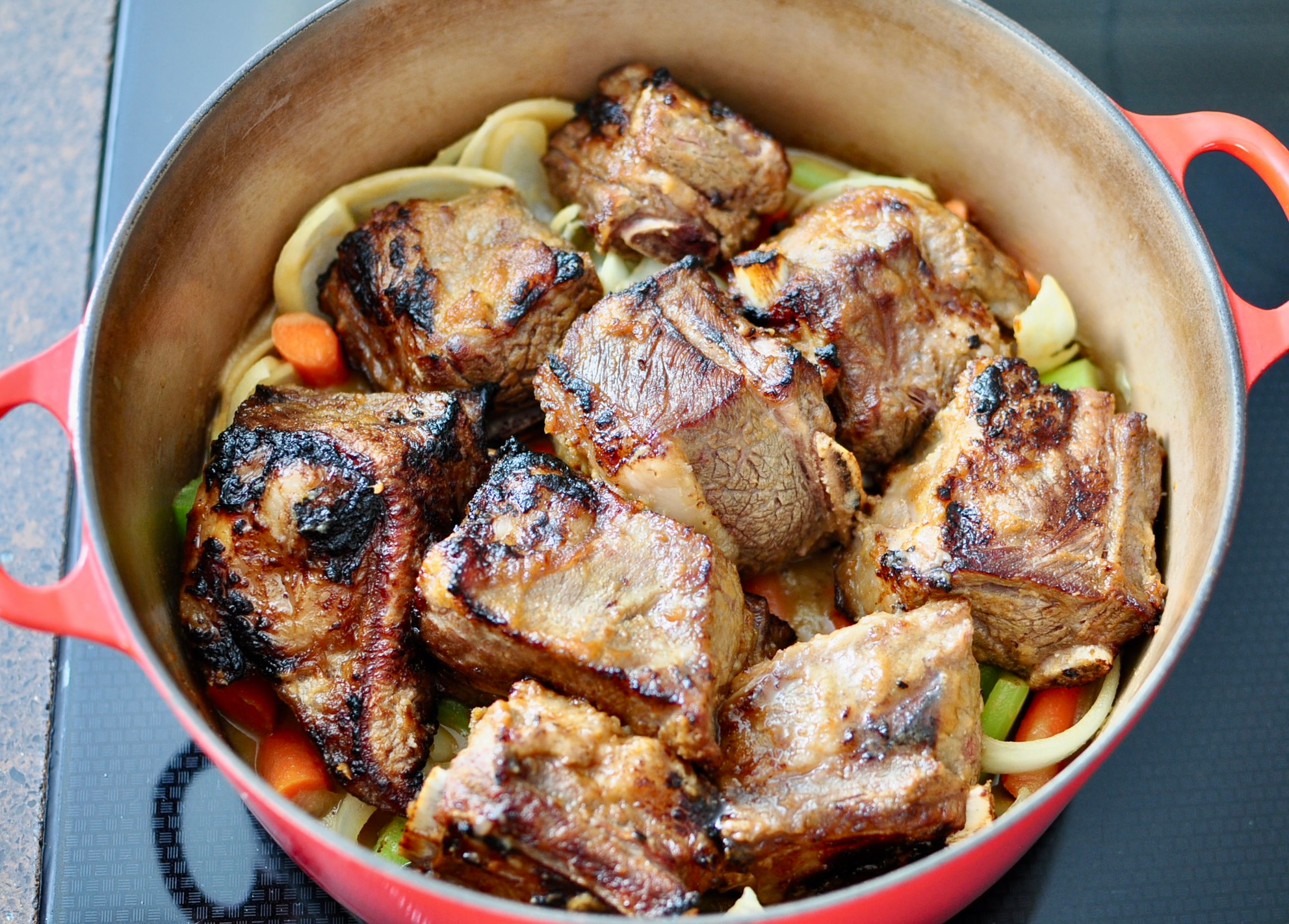 Short ribs on top of vegetables