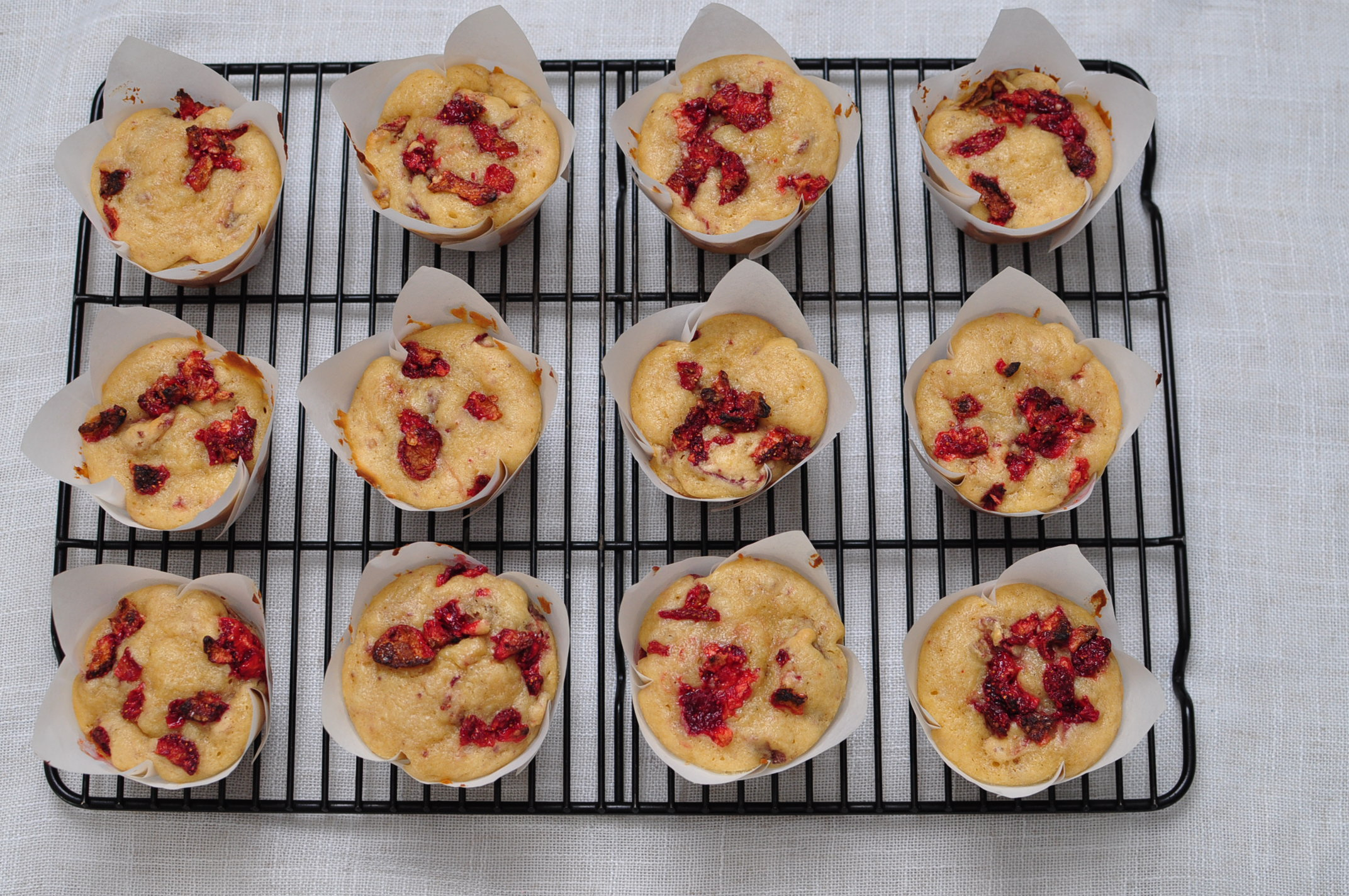 Strawberry muffins on cooling rack