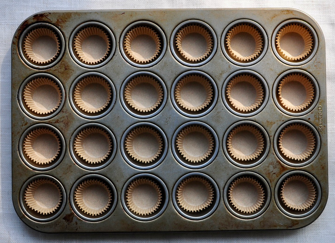 Bite Sized Cheesecake Made in a Lined Mini Muffin Pan