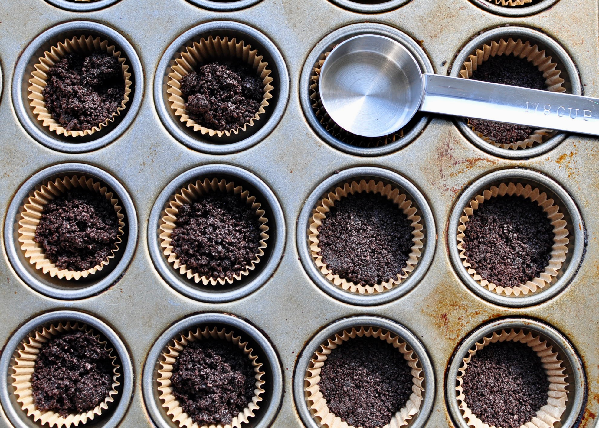 Press Crushed Oreos for Cheesecake Crust