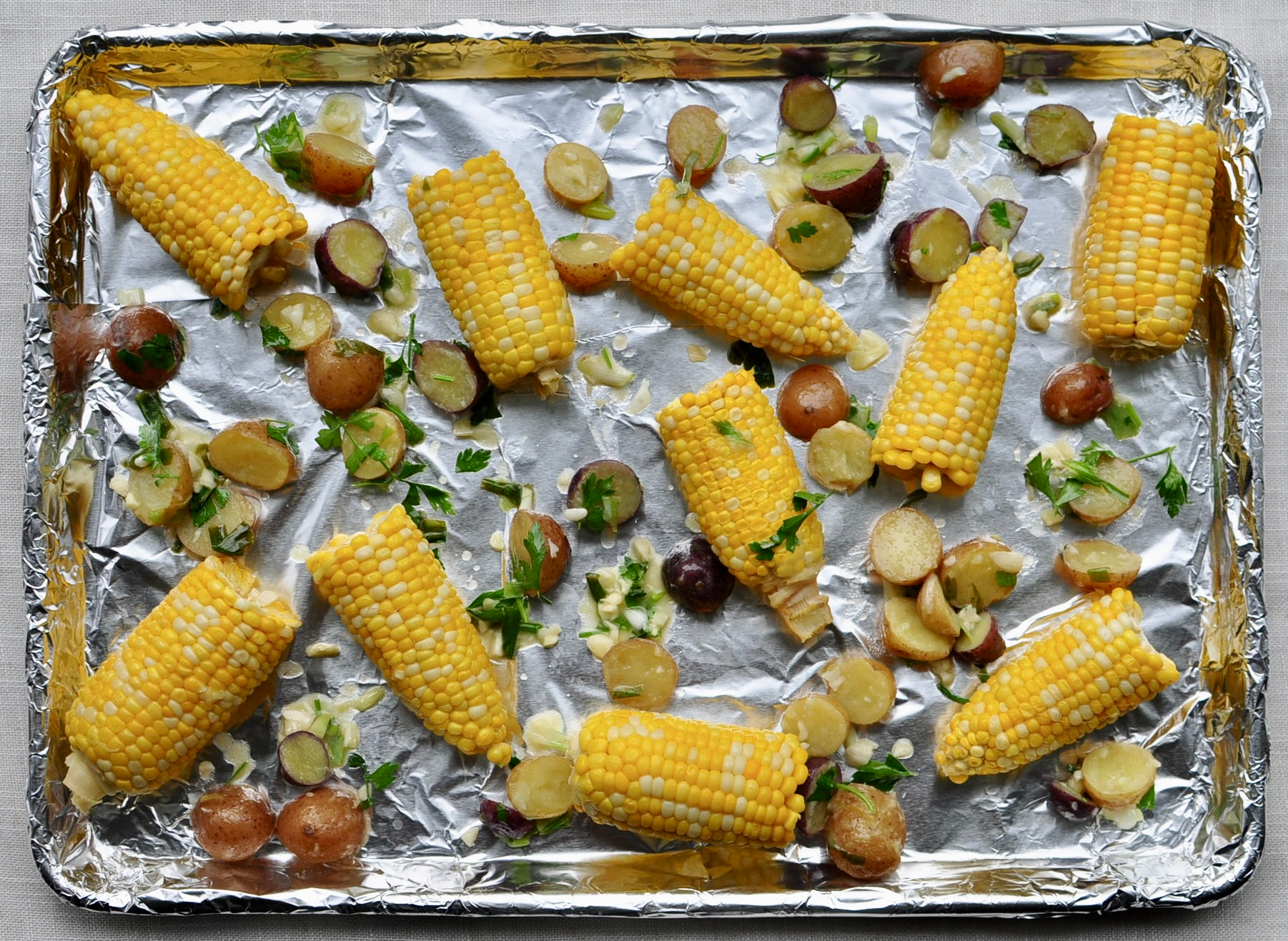 Sheet Pan Clam Bake Recipe with Corn and Little Potatoes