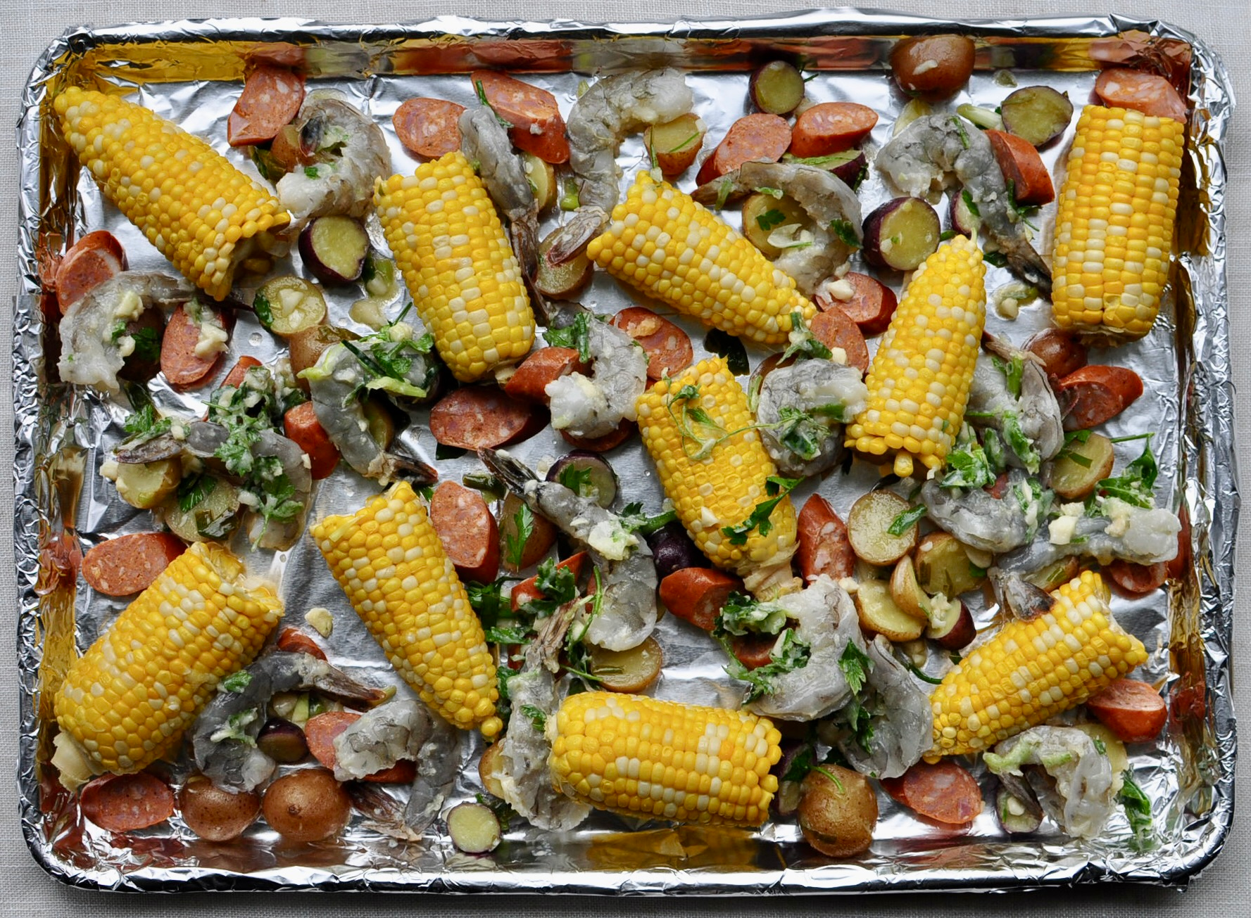 Sheet Pan Clam Bake with Corn, Potatoes, Andouille Sausage and Shrimp