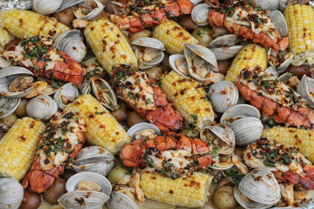 Sheet Pan Clam Bake with Lobster Tails, Shrimp, Clams and Chili Crisp