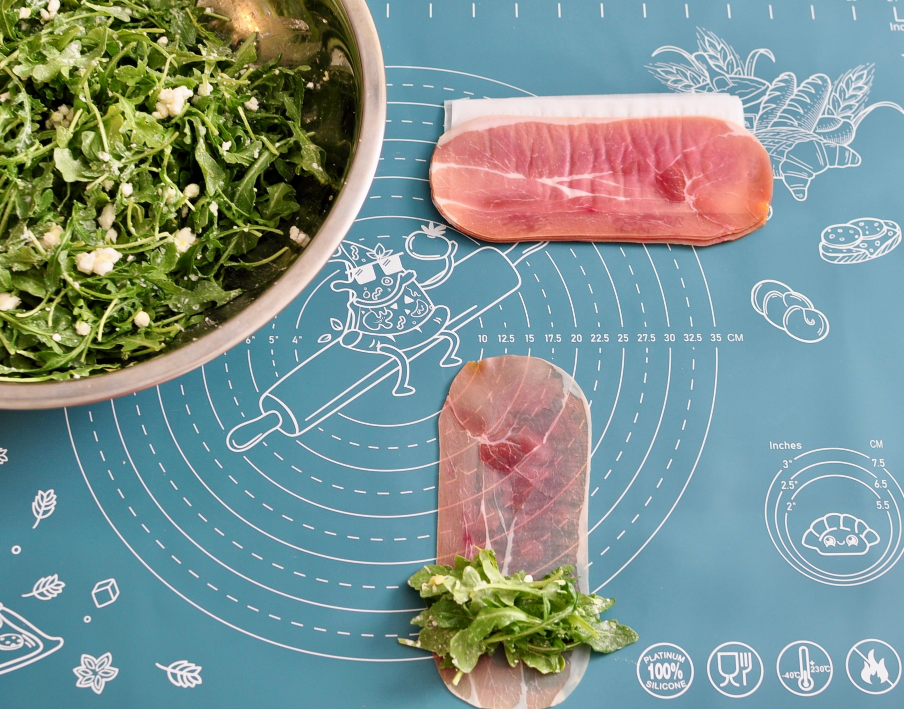Arugula Tossed with Lemon and Goat Cheese for Prosciutto Roll